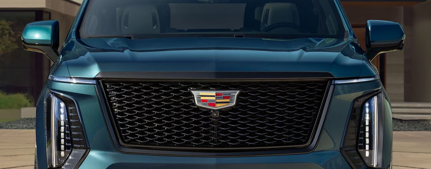 Front and grille on a blue 2026 Cadillac Escalade